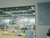 A modern Fab Lab workspace featuring various machines and workstations.