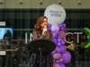 A woman speaking at an event promoting women in STEM.