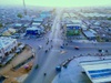Aerial view of a busy urban intersection in a city during early morning.