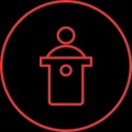 A minimalistic graphic representation of a person at a podium.