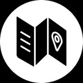 A stylized icon representing a folded map with a location pin.