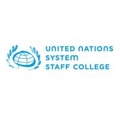 The logo of the United Nations System Staff College.
