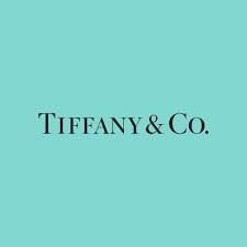 Logo of Tiffany & Co. on a teal background.