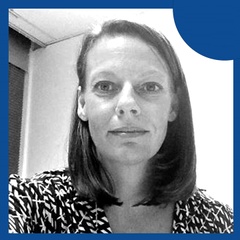 Professional portrait of a woman with a confident expression, featuring black and white tones with a blue circular graphic element.