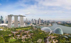 A panoramic view of Singapore's skyline featuring modern architecture and lush greenery.