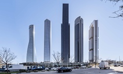 A modern city skyline featuring five distinct skyscrapers.
