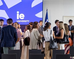 A group of people interacting at a university event.