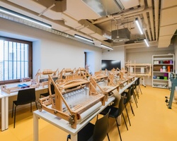 A spacious workshop filled with wooden models and tools for construction and creativity.