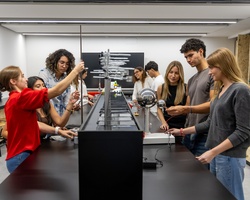 A group of students engaged in a science experiment in a laboratory.