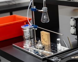 A laboratory setup featuring glassware and equipment for conducting experiments.