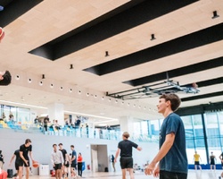 A basketball player is dunking the ball during practice.