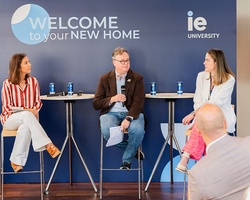 A panel discussion featuring three speakers at IE University.