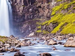 A picture of "Gufufoss" which is a waterfall located in Iceland, represents the IE Alumni Iceland Club