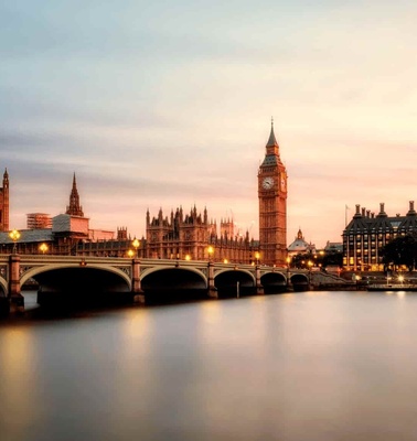 A scenic view of the Westminster Bridge and the Big Ben in London at dusk.