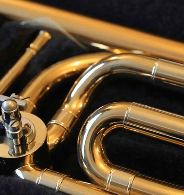 Close-up view of a shiny brass trumpet in a case.