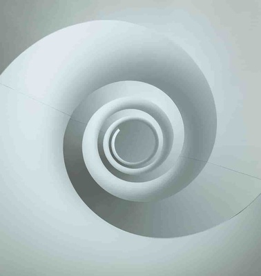 Overhead view of a spiral staircase with a minimalist design.