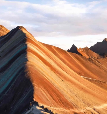A stunning view of multicolored mountain ridges at sunset