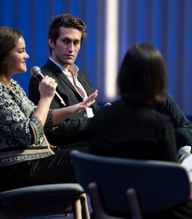 Woman speaking in a conference during an IE event