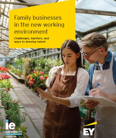 A man and a woman in aprons examining plants in a greenhouse, with text about family businesses above them.