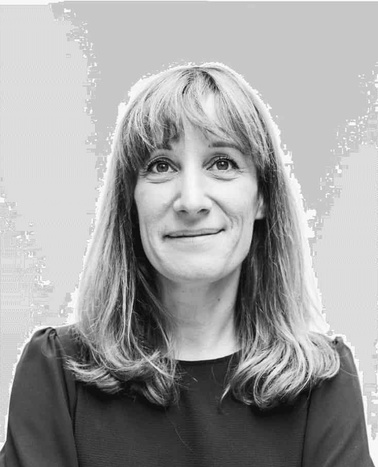 Black and white portrait of a woman with a neutral expression and medium-length hair.