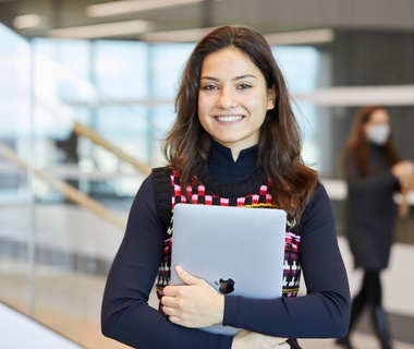 IE Student at IE Tower smiling