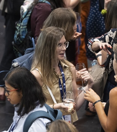 A group of women engaging in conversation at a networking event.