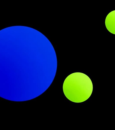 The image features various circles in vibrant colors against a black background.