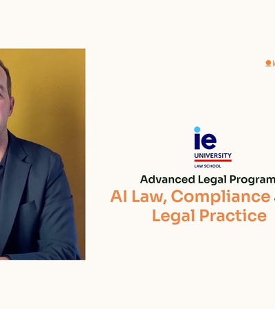 A man presents information about an advanced legal program focused on AI law and compliance.