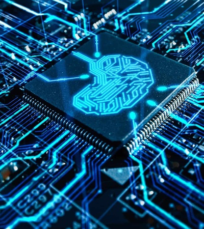 A close-up view of a microchip surrounded by intricate blue circuitry.