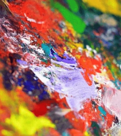 A close-up view of a vibrant, multicolored abstract painting.