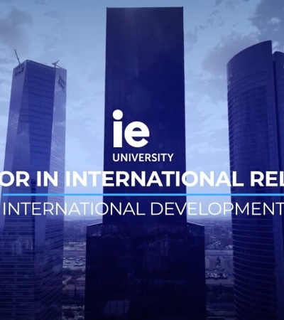 Advertisement for IE University's Bachelor in International Relations program, featuring skyscrapers in the background.