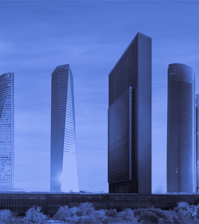 A skyline featuring modern skyscrapers in shades of blue.