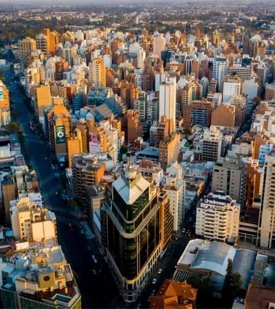 Aerial view of a bustling city skyline with numerous buildings and streets.