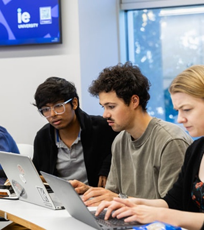 A group of students engaged in their studies at a university classroom.