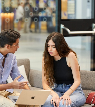 Two IE students speaking