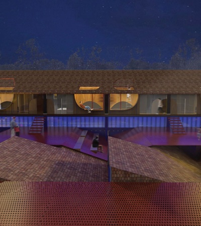 The image shows a modern architectural design at night featuring a building with unique roof structures and illuminated interiors.