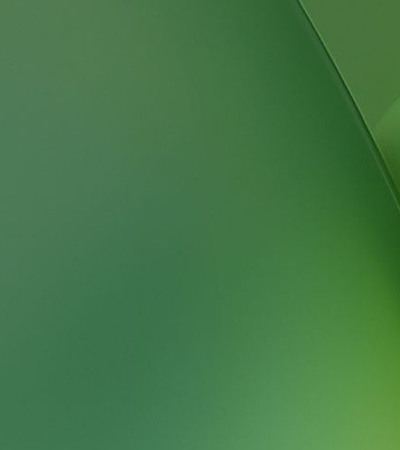 A smooth gradient featuring various shades of green.