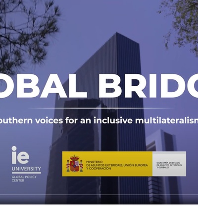 An image featuring a modern cityscape with the text 'GLOBAL BRIDGES' and information about a university event.