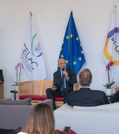 A conference setting with officials discussing EU-LAC relations.