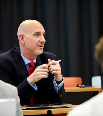 Global Executive MBA student paying attention during a class