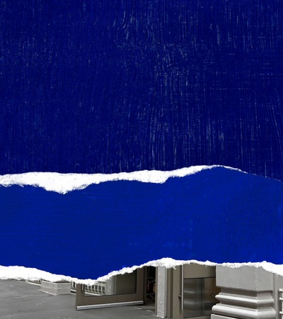 The image features a bold blue torn paper design juxtaposed with a city street view.