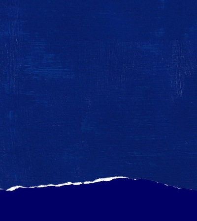 A textured blue background with a torn edge at the bottom.