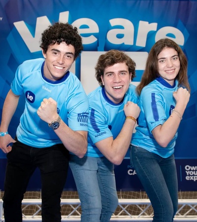Three student dressed  with blue t-shirts for IE Sport & well being header