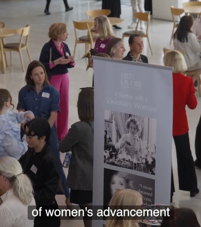 A lively gathering focused on women's advancement with attendees engaging and networking.