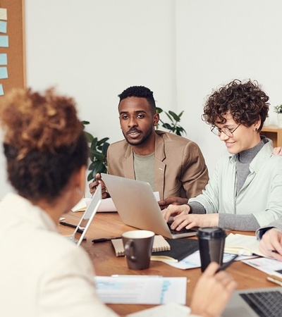 People discussing in a meeting room.