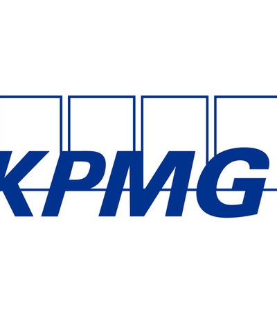 The logo of KPMG in blue letters with a simple design.
