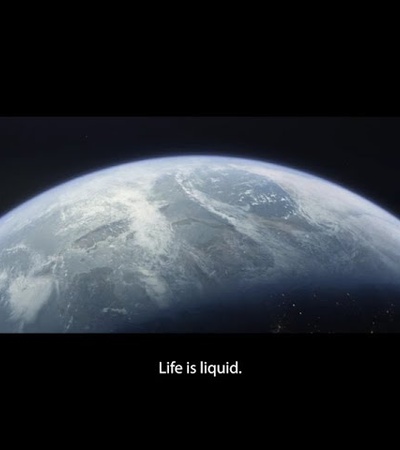A distant view of Earth with the caption 'Life is liquid.'