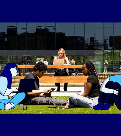 A group of people enjoying a sunny day outdoors, sitting on a grassy area with a modern building in the background.