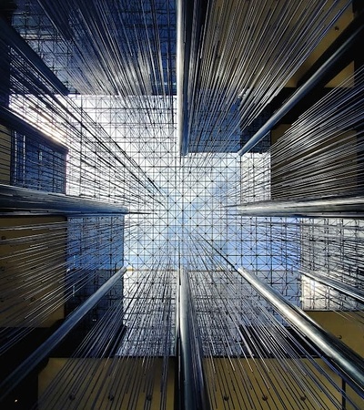 An abstract view of a ceiling with linear elements radiating from the center.
