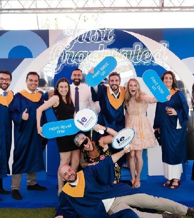 A group of graduates celebrating their achievement at a graduation ceremony.